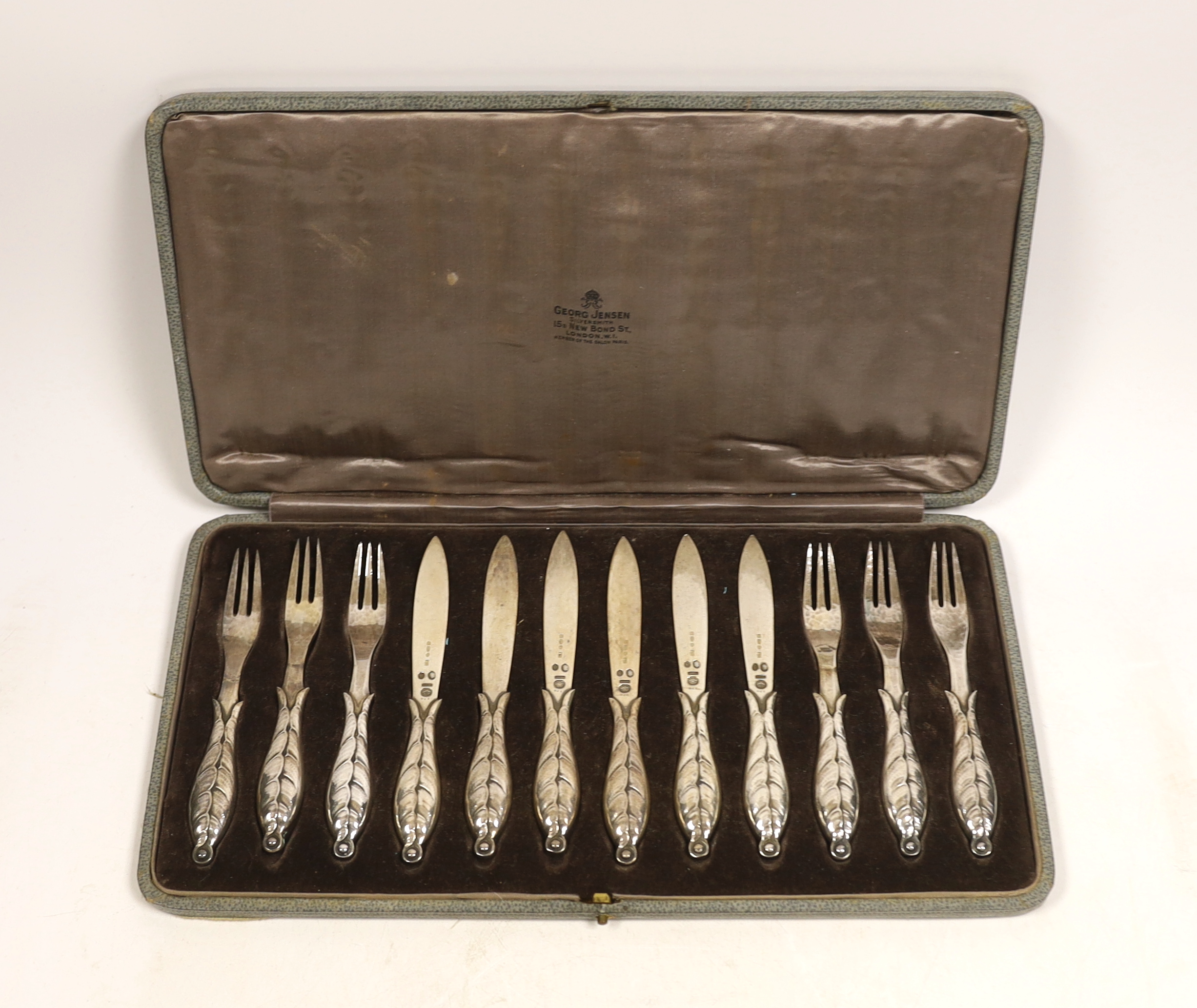 Six pairs of 1920's Georg Jensen silver dessert eaters, design no. 124, import marks for London, 1926, in original Georg Jensen box.